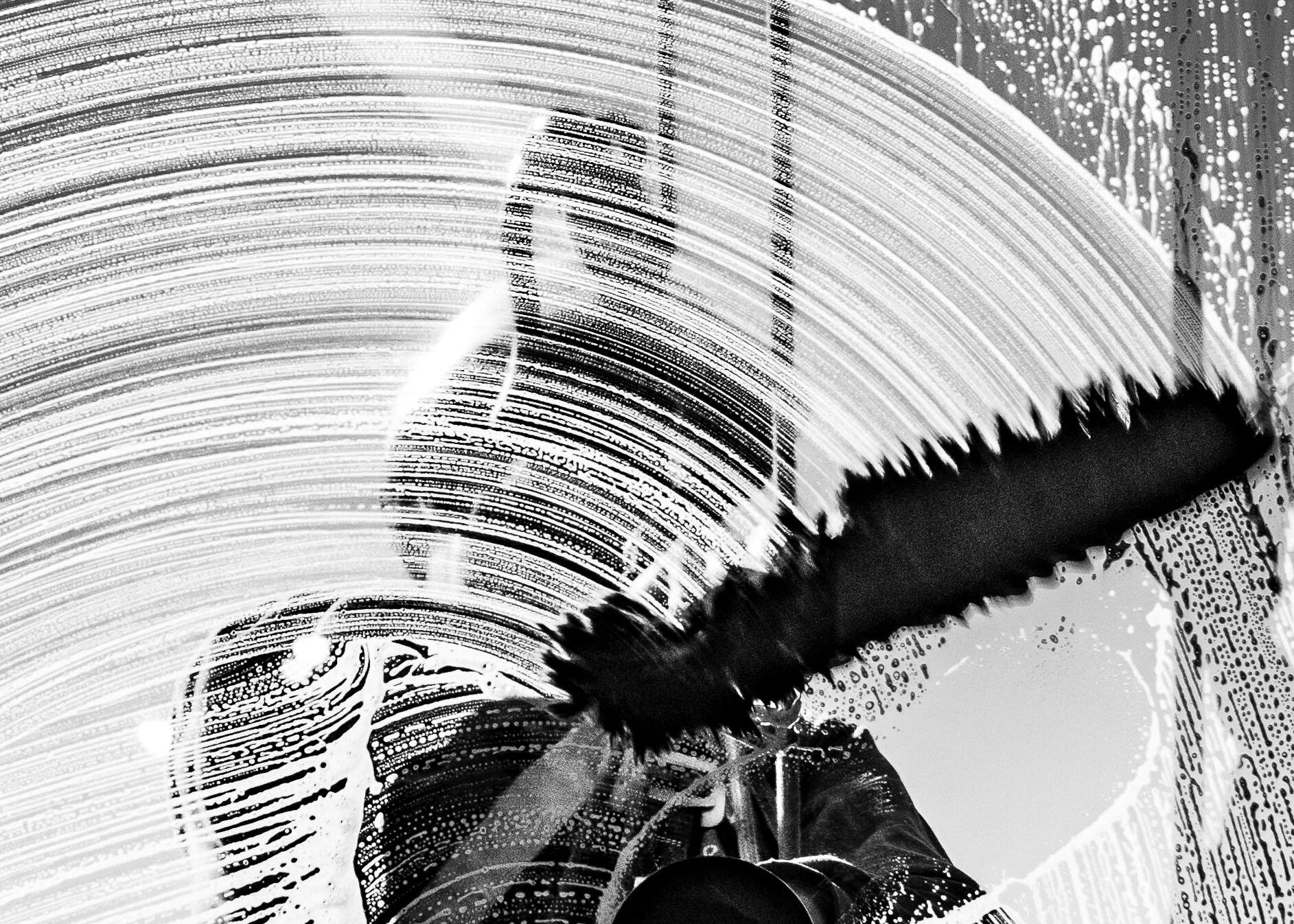 Artistic abstract image of a worker cleaning a window in Buenos Aires.